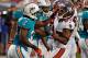 MIAMI GARDENS - AUGUST 10: Defensive back Richard Marshall #31 of the Miami Dolphins grabs receiver Preston Parker #87 of the Tampa Bay Buccaneers as tempers flare during the NFL Preseason Game at Sun Life Stadium on August 10, 2012 in Miami Gardens, Florida. (Photo by J. Meric/Getty Images)
