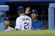LOS ANGELES, CA - MAY 15: Zack Greinke #21 of the Los Angeles Dodgers is greeted in the dugout by Clayton Kershaw#22 after being relieved in the sixth inning of the game against the Washington Nationals at Dodger Stadium on May 15, 2013 in Los Angeles, California. (Photo by Stephen Dunn/Getty Images)