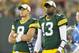 Aug 9, 2013; Green Bay, WI, USA; Green Bay Packers quarterbacks B.J. Coleman (9) and Vince Young (13) look on during the fourth quarter against the Arizona Cardinals at Lambeau Field. The Cardinals won 17-0. Mandatory Credit: Jeff Hanisch-USA TODAY Sports