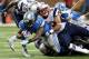 Aug 22, 2013; Detroit, MI, USA; Detroit Lions running back Joique Bell (35) is tackled by New England Patriots defensive end Jake Bequette (92) during 2nd half at Ford Field. Lions won 40-9. Mandatory Credit: Mike Carter-USA TODAY Sports