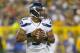 Aug 23, 2013; Green Bay, WI, USA; Seattle Seahawks quarterback Russell Wilson (3) drops back to pass during the second quarter against the Green Bay Packers at Lambeau Field. Mandatory Credit: Jeff Hanisch-USA TODAY Sports