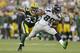GREEN BAY, WI - AUGUST 23: Doug Baldwin #89 of the Seattle Seahawks runs upfield with Micah Hyde #33 of the Green Bay Packers in pursuit during a preseason game at Lambeau Field on August 23, 2013 in Green Bay, Wisconsin. (Photo by Mike McGinnis/Getty Images)