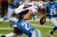 DETROIT, MI - AUGUST 22: Kanorris Davis #44 of the New England Patriots fumbles the ball after being hit by Glover Quin #27 of the Detroit Lions during the first quarter during a pre season game at Ford Field on August 22, 2013 in Detroit, Michigan. (Photo by Gregory Shamus/Getty Images)