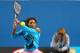 Serena Williams practices at the Australian Open as her mother, Oracene Price, looks on.