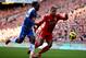 LIVERPOOL, ENGLAND - FEBRUARY 12: Victor Moses of Wigan Athletic competes with Glen Johnson of Liverpool during the Barclays Premier League match between Liverpool and Wigan Athletic at Anfield on February 12, 2011 in Liverpool, England. (Photo by Clive Brunskill/Getty Images)