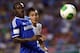 BANGKOK, THAILAND - JULY 17: Victor Moses of Chelsea is checked by Nattaporn of Singha Thailand All-Star XI during the international friendly match between Chelsea FC and the Singha Thailand All-Star XI at the Rajamangala Stadium in Bangkok, Thailand on July 17, 2013 in Bangkok, Thailand. (Photo by Stanley Chou/Getty Images)
