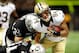 NEW ORLEANS, LA - AUGUST 16: Kenny Stills #84 of the New Orleans Saints is tackled by Tyvon Branch #33 and Tracy Porter #31 of the Oakland Raiders during a preseason game at the Mercedes-Benz Superdome on August 16, 2013 in New Orleans, Louisiana. (Photo by Stacy Revere/Getty Images)