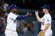 LOS ANGELES, CA - AUGUST 23: Hanley Ramirez #13 and Mark Ellis #14 of the Los Angeles Dodgers celebrate a 2-0 win over the Boston Red Sox at Dodger Stadium on August 23, 2013 in Los Angeles, California. (Photo by Harry How/Getty Images)