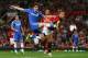 MANCHESTER, ENGLAND - AUGUST 26: Oscar of Chelsea is challenged by Nemanja Vidic of Manchester United during the Barclays Premier League match between Manchester United and Chelsea at Old Trafford on August 26, 2013 in Manchester, England. (Photo by Alex Livesey/Getty Images)