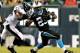 PHILADELPHIA, PA - AUGUST 15: Kenjon Barner #25 of the Carolina Panthers carries the ball as Earl Wolff #28 of the Philadelphia Eagles defends on August 15, 2013 at Lincoln Financial Field in Philadelphia, Pennslyvania. (Photo by Elsa/Getty Images)