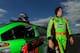 BROOKLYN, MI - AUGUST 16: Danica Patrick, driver of the #10 GoDaddy Chevrolet, walks from her car after qualifying for the NASCAR Sprint Cup Series 44th Annual Pure Michigan 400 at Michigan International Speedway on August 16, 2013 in Brooklyn, Michigan. (Photo by Mike Ehrmann/Getty Images)