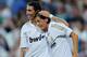 MADRID, SPAIN - AUGUST 14: Mesut Oezil (R) of Real Madrid celebrates with Angel Di Maria after scoring Real's opening goal during the Super Cup first leg match between Real Madrid and Barcelona at Estadio Santiago Bernabeu on August 14, 2011 in Madrid, Spain. (Photo by Denis Doyle/Getty Images)