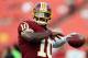 LANDOVER, MD - AUGUST 19: Quarterback Robert Griffin III #10 of the Washington Redskins warms up left handed before the start of a preseason game against the Pittsburgh Steelers at FedExField on August 19, 2013 in Landover, Maryland. (Photo by Rob Carr/Getty Images)