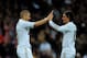 MADRID, SPAIN - JANUARY 07: Karim Benzema (L) of Real Madrid celebrates with Mesut Ozil after scoring his third goal and Real's fourth during the La Liga match between Real Madrid and Granada at Estadio Santiago Bernabeu on January 7, 2012 in Madrid, Spain. (Photo by Denis Doyle/Getty Images)