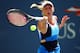 NEW YORK, NY - AUGUST 27: Caroline Wozniacki of Denmark returns a shot during her women's singles first round match against Ying-Ying Duan of China on Day Two of the 2013 US Open at USTA Billie Jean King National Tennis Center on August 27, 2013 in the Flushing neighborhood of the Queens borough of New York City. (Photo by Elsa/Getty Images)