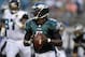 Aug 24, 2013; Jacksonville, FL, USA; Philadelphia Eagles quarterback Michael Vick (7) rolls out to throw a pass during the first quarter of their game against the Jacksonville Jaguars at EverBank Field. Mandatory Credit: Phil Sears-USA TODAY Sports