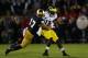 SOUTH BEND, IN - SEPTEMBER 22: Safety Zeke Motta #17 of the Notre Dame Fighting Irish tackles wide receiver Devin Gardner #12 of the Michigan Wolverines in the first quarter at Notre Dame Stadium on September 22, 2012 in South Bend, Indiana. (Photo by Jonathan Daniel/Getty Images)