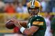 GREEN BAY, WI - AUGUST 09: Aaron Rodgers #12 of the Green Bay Packers participates in warm-ups before a game against the Arizona Cardinals at Lambeau Field on August 9, 2013 in Green Bay, Wisconsin. (Photo by Jonathan Daniel/Getty Images)