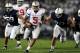 STATE COLLEGE, PA - OCTOBER 27: Quarterback Braxton Miller #5 of the Ohio State Buckeyes rushes past linebacker Glenn Carson #40 of the Penn State Nittany Lions in the second quarter at Beaver Stadium on October 27, 2012 in State College, Pennsylvania. (Photo by Patrick Smith/Getty Images)
