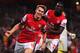 LONDON, ENGLAND - AUGUST 27: Aaron Ramsey (L) of Arsenal celebrates with team mate Yaya Sanogo after scoring his sides second goal during the UEFA Champions League Play Off Second leg match between Arsenal FC and Fenerbahce SK at Emirates Stadium on August 27, 2013 in London, England. (Photo by Michael Regan/Getty Images)