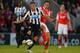 MORECAMBE, ENGLAND - AUGUST 28: Dan Gosling of Newcasle battles Stewart Drummond of Morecambe during the Capital One Cup Second Round match between Morecambe and Newcastle United at the Globe Arena on August 28, 2013 in Morecambe, England. (Photo by Michael Regan/Getty Images)
