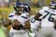 GREEN BAY, WI - AUGUST 23: Russell Wilson #3 of the Seattle Seahawks drops back to pass during the game against the Green Bay Packers at Lambeau Field on August 23, 2013 in Green Bay, Wisconsin. (Photo by Mike McGinnis/Getty Images)
