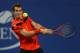 NEW YORK, NY - AUGUST 28: Andy Murray of Great Britain plays a backhand during his men's singles first round match against Michael Llodra of France on Day Three of the 2013 US Open at USTA Billie Jean King National Tennis Center on August 28, 2013 in the Flushing neighborhood of the Queens borough of New York City. (Photo by Elsa/Getty Images)