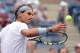 Aug 26, 2013; New York, NY, USA; Rafael Nadal (ESP) hits a ball into the crowd after defeating Ryan Harrison (USA) on day one of the 2013 US Open at the Billie Jean King National Tennis Center. Mandatory Credit: Robert Deutsch-USA TODAY Sports