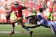 SAN FRANCISCO, CA - AUGUST 25: Colin Kaepernick #7 of the San Francisco 49ers scrambles away from the rush of Fred Evans #90 of the Minnesota Vikings in the first quarter at Candlestick Park on August 25, 2013 in San Francisco, California. (Photo by Thearon W. Henderson/Getty Images)