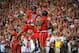 LINCOLN, NE - SEPTEMBER 29: Running back Braylon Heard #5 celebrates with defensive end Jason Ankrah #9 of the Nebraska Cornhuskers during their game against the Wisconsin Badgers at Memorial Stadium on September 29, 2012 in Lincoln, Nebraska. (Photo by Eric Francis/Getty Images)