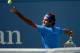 Aug 29, 2013; New York, NY, USA; Roger Federer (SUI) serves against Carlos Berlocq (ARG) on day four of the 2013 US Open at the Billie Jean King National Tennis Center. Mandatory Credit: Robert Deutsch-USA TODAY Sports