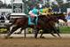 ELMONT, NY - JUNE 09: Union Rags ridden by John Velazquez narrowly beats Paynter ridden by Mike Smith during the 144th running of the Belmont Stakes at Belmont Park on June 9, 2012 in Elmont, New York. (Photo by Alex Trautwig/Getty Images)