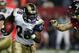 ATLANTA, GA - JANUARY 15: Marshall Faulk #28 of the St. Louis Rams runs against the defense of the Atlanta Falcons during the NFC Divisional Playoff game during the NFC Divisional Playoff game at the Georgia Dome on January 15, 2005 in Atlanta, Georgia. (Photo by Streeter Lecka/Getty Images)