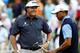 NORTON, MA - AUGUST 30: Tiger Woods (R) and Phil Mickelson of the USA react on the 11th green during the first round of the Deutsche Bank Championship at TPC Boston on August 30, 2013 in Norton, Massachusetts. (Photo by Jim Rogash/Getty Images)