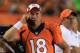 DENVER, CO - AUGUST 29: Quarterback Peyton Manning #18 of the Denver Broncos talks on the phone on the sidelines as they Broncos host the Arizona Cardinals during preseason action at Sports Authority Field at Mile High on August 29, 2013 in Denver, Colorado. (Photo by Doug Pensinger/Getty Images)