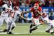 ATLANTA, GA - DECEMBER 01: Running back Todd Gurley #3 of the Georgia Bulldogs carries the ball while being tackled by linebacker Trey DePriest #33 and defensive back Deion Belue #13 of the Alabama Crimson Tide during first half of the SEC Championship Game at the Georgia Dome on December 1, 2012 in Atlanta, Georgia. (Photo by Kevin C. Cox/Getty Images)