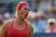 NEW YORK, NY - AUGUST 29: Victoria Azarenka of Belarus reacts during her women's singles second round match against Aleksandra Wozniak of Canada on Day Four of the 2013 US Open at the USTA Billie Jean King National Tennis Center on August 29, 2013 in New York City. (Photo by Mike Stobe/Getty Images for the USTA)