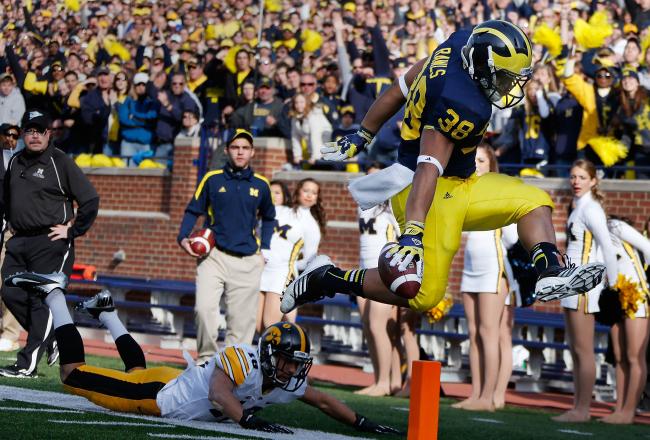 Thomas Rawls punches one in the end zone (photo from vs. Iowa, 2012)