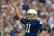 Aug 31, 2013; South Bend, IN, USA; Notre Dame Fighting Irish quarterback Tommy Rees (11) celebrates after throwing a touchdown pass in the first quarter against the Temple Owls at Notre Dame Stadium. Mandatory Credit: Matt Cashore-USA TODAY Sports
