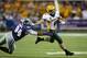 Aug 30, 2013; Manhattan, KS, USA; North Dakota State Bison wide receiver Ryan Smith (4) runs by Kansas State Wildcats defensive end Alauna Finau (94) during the Bisons' 24-21 win at Bill Snyder Family Stadium. Mandatory Credit: Scott Sewell-USA TODAY Sports