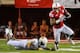 LINCOLN, NE - AUGUST 31: Running back Ameer Abdullah #8 of the Nebraska Cornhuskers runs past safety Marqueston Huff #2 of the Wyoming Cowboys during their game at Memorial Stadium on August 31, 2013 in Lincoln, Nebraska. (Photo by Eric Francis/Getty Images)