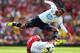 LONDON, ENGLAND - SEPTEMBER 01: Etienne Capoue of Spurs leaps over a challenge from Aaron Ramsey of Arsenal during the Barclays Premier League match between Arsenal and Tottenham Hotspur at Emirates Stadium on September 01, 2013 in London, England. (Photo by Clive Mason/Getty Images)