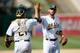 OAKLAND, CA - SEPTEMBER 01: Ryan Cook #48 and Stephen Vogt #21 of the Oakland Athletics celebrate defeating the Tampa Bay Rays 5-1 at O.co Coliseum on September 1, 2013 in Oakland, California. (Photo by Thearon W. Henderson/Getty Images)