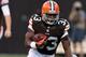 Aug 15, 2013; Cleveland, OH, USA; Cleveland Browns running back Trent Richardson (33) against Detroit Lions strong safety Don Carey (32) at FirstEnergy Field. Mandatory Credit: Ron Schwane-USA TODAY Sports