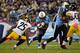 NASHVILLE, TN - OCTOBER 11: Chris Johnson #28 of the Tennessee Titans is tackled by Ryan Clark #25 of the Pittsburgh Steelers at LP Field on October 11, 2012 in Nashville, Tennessee. (Photo by Frederick Breedon/Getty Images)