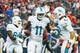 HOUSTON, TX - AUGUST 17: Mike Wallace #11 of the Miami Dolphins celebrates with Brian Hartline #82 after Wallace scored a 9-yard toudhdown in the first half against the Houston Texans during a preseaon game at Reliant Stadium on August 17, 2013 in Houston, Texas. (Photo by Scott Halleran/Getty Images)
