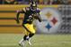 Aug 24, 2013; Pittsburgh, PA, USA; Pittsburgh Steelers running back Felix Jones (23) carries the ball against the Kansas City Chiefs during the second quarter at Heinz Field. The Kansas City Chiefs won 26-20 in overtime. Mandatory Credit: Charles LeClaire-USA TODAY Sports