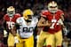 SAN FRANCISCO, CA - JANUARY 12: Quarterback Colin Kaepernick #7 of the San Francisco 49ers runs the ball against nose tackle B.J. Raji #90 of the Green Bay Packers during the NFC Divisional Playoff Game at Candlestick Park on January 12, 2013 in San Francisco, California. (Photo by Harry How/Getty Images)