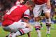 LONDON, ENGLAND - AUGUST 27: Lukas Podolski (L) of Arsenal is injured during the UEFA Champions League Play Off Second leg match between Arsenal FC and Fenerbahce SK at Emirates Stadium on August 27, 2013 in London, England. (Photo by Michael Regan/Getty Images)