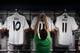 MADRID, SPAIN - SEPTEMBER 02: An employee displays new Gareth Bale Real Madrid shirts at the Real Madrid Oficcial Store alongside Mesut Ozil's shirt on the day Gareth Bale is presented as a new Real Madrid player at Estadio Santiago Bernabeu on September 2, 2013 in Madrid, Spain. (Photo by Gonzalo Arroyo Moreno/Getty Images)
